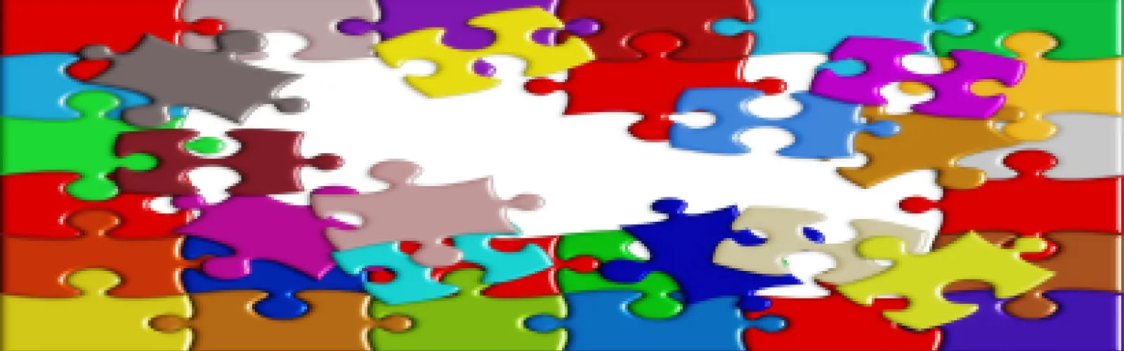 Different colored puzzle pieces being put together